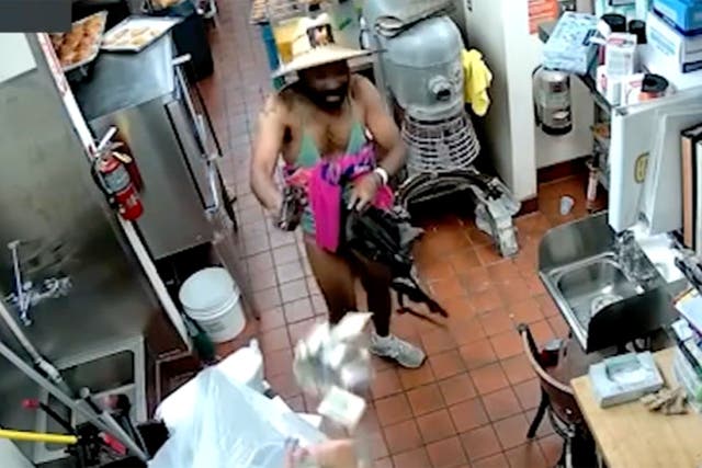 <p>An armed man dressed in a bikini was captured on video attempting to rob a Los Angeles donut shop</p>