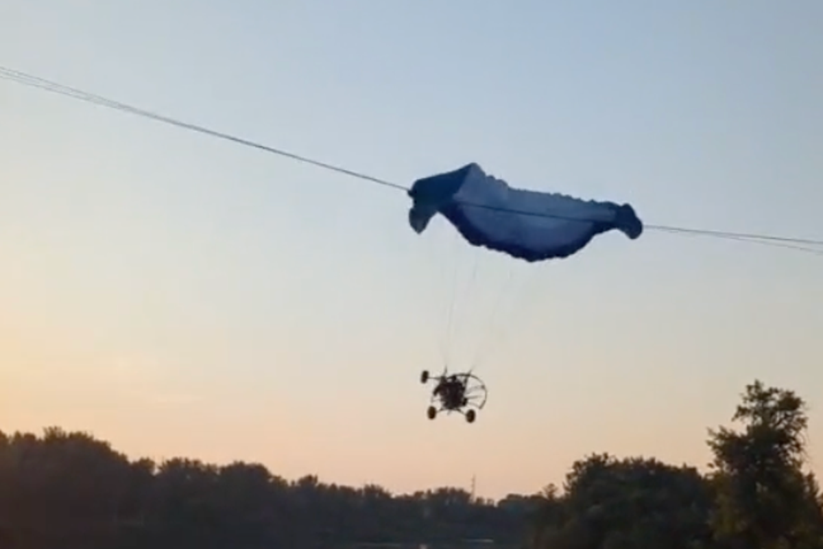 Moment paraglider flies into power lines in North Dakota