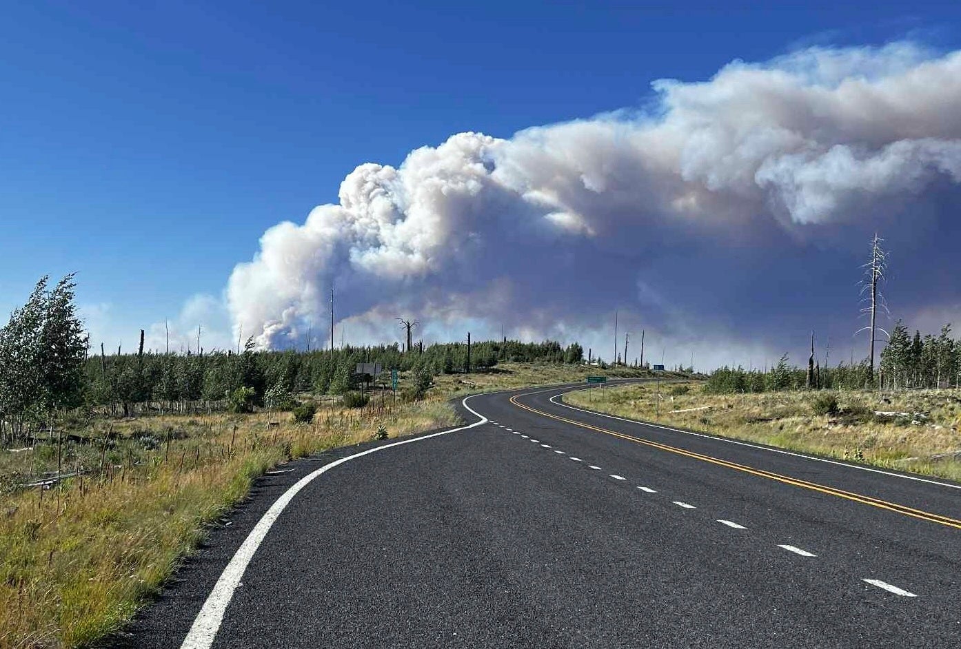 A massive wall of wildfire smoke billows into the sky near the Grand Canyon's North Rim, in northern Arizona, on Thursday, July 10