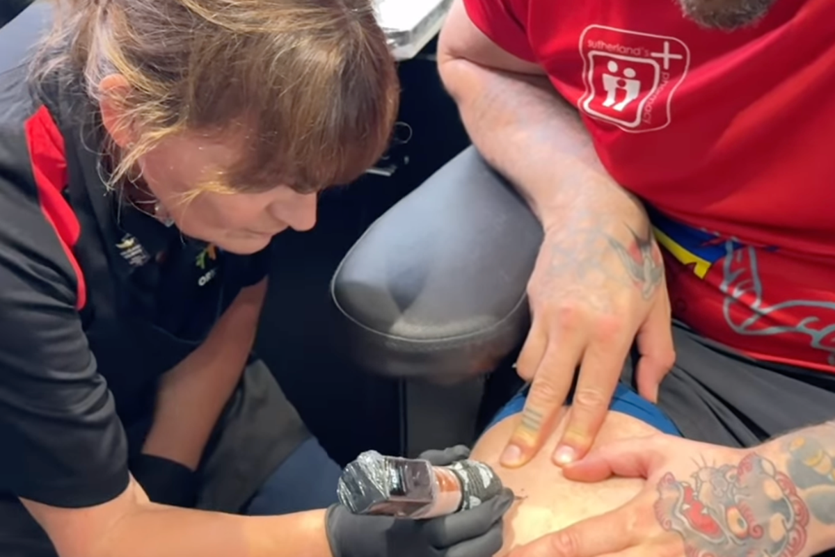 Lorraine Kelly swaps TV studio for tattoo parlour as she inks athlete