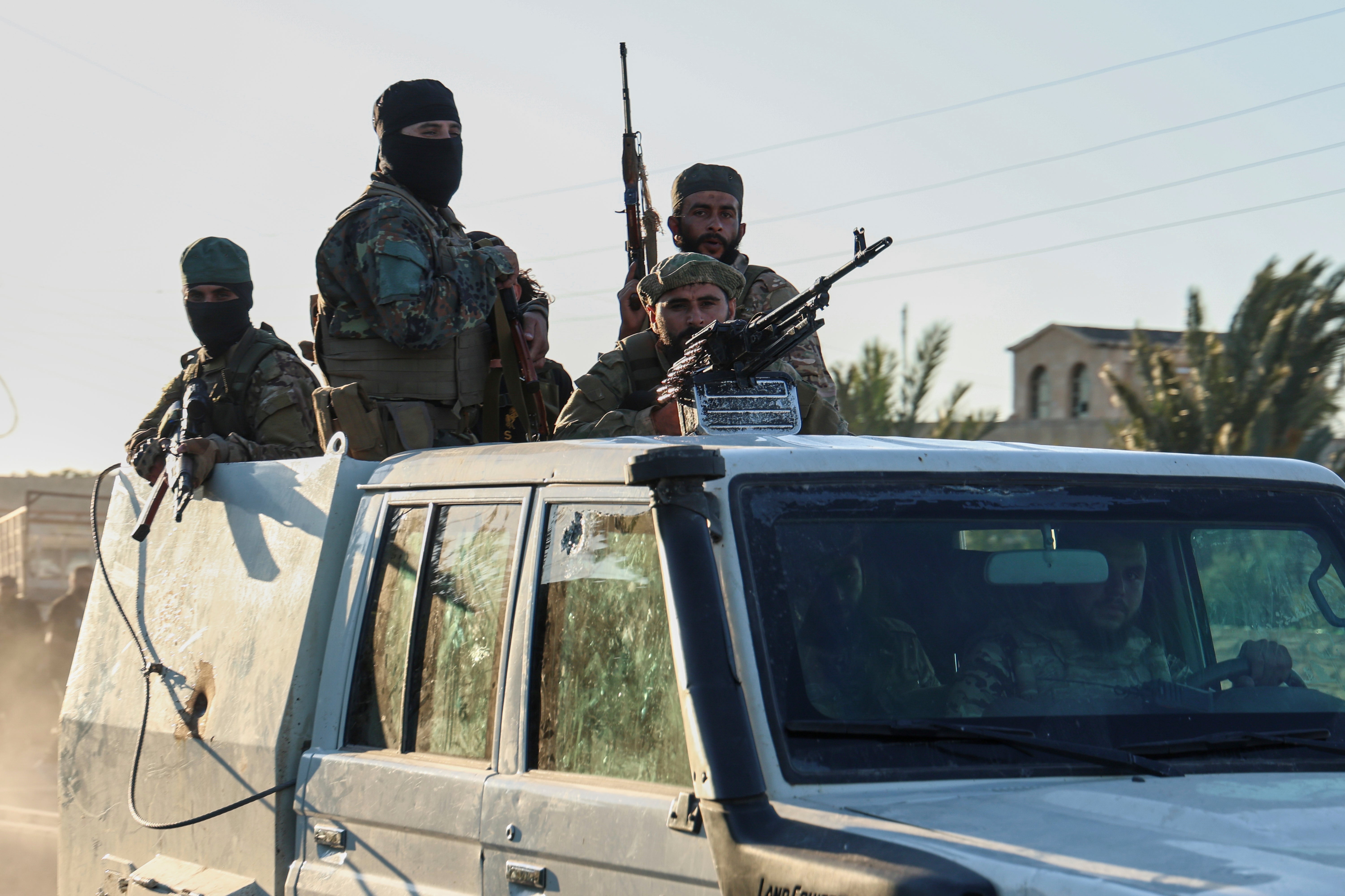 Syrian government forces in Mazraa village on the outskirts of Sweida