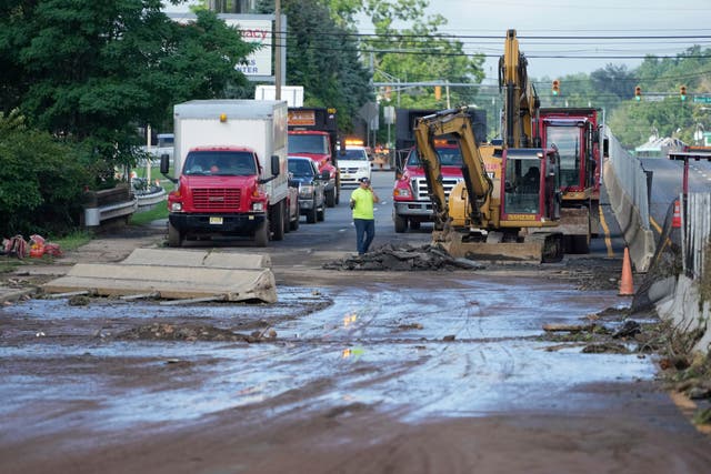 <p>In Plainfield roads were left destroyed and pieces of sidewalks were missing, with debris strewn everywhere<em> (AP)</em></p>