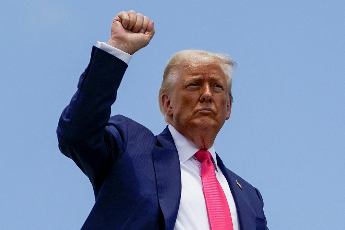 https://static.independent.co.uk/2025/07/15/20/45/U-S--President-Donald-Trump-raises-his-fist-while-boarding-Air-Force-One-as-he-departs-for-Pennsylva.jpeg?width=1200&height=800&crop=1200:800
