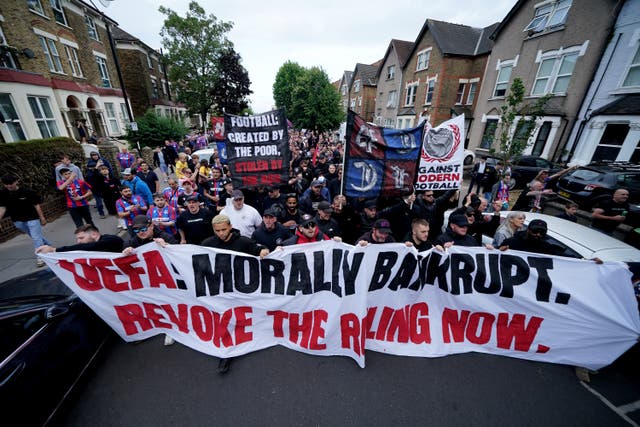 <p>Crystal Palace fans during a protest march against UEFA’s decision to demote them to the Conference League</p>