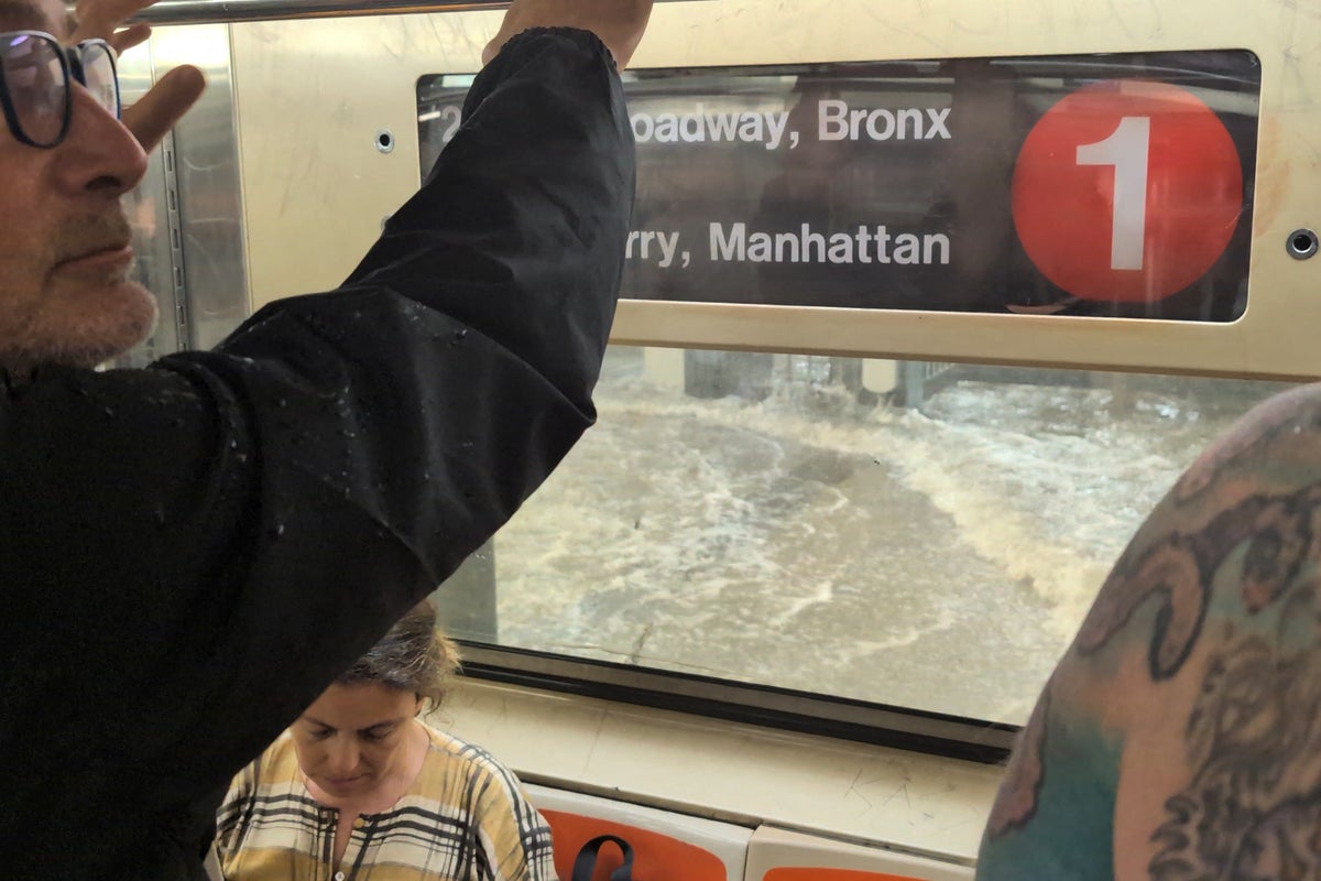 Flash floods gush into NYC subway carriage as passengers look on in shock