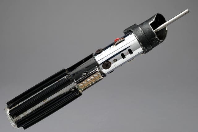 <p>Darth Vader’s lightsaber is up for auction (Propstore/PA)</p>