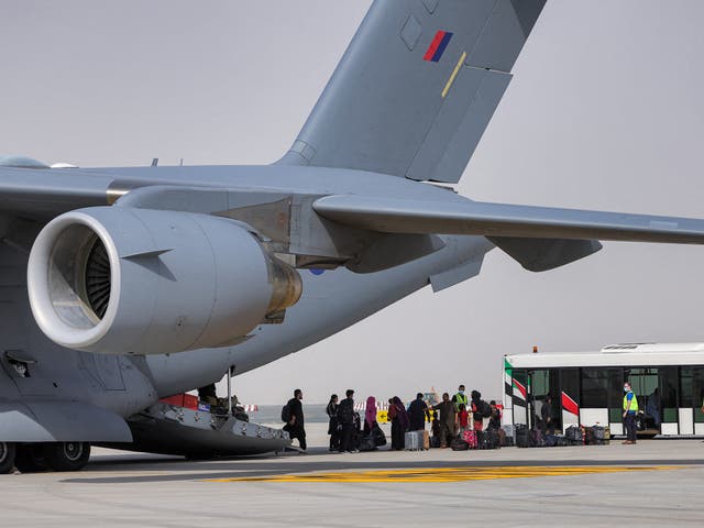 <p>People disembark off a Royal Air Force Boeing C-17A Globemaster III military transport aircraft carrying evacuees from Afghanistan</p>