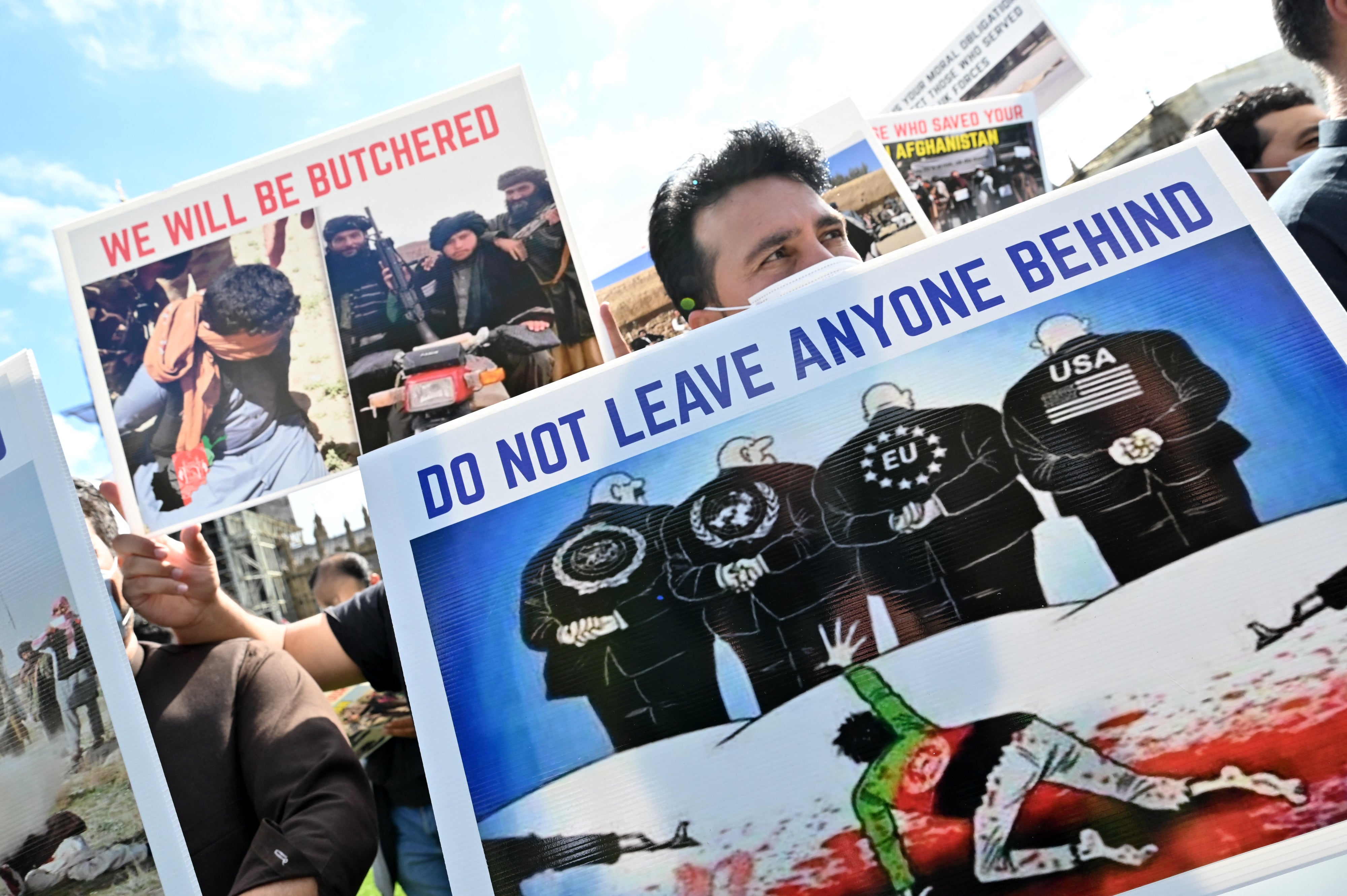 Demonstrators, including former interpreters for the British army in Afghanistan, protest opposite parliament in August 2021
