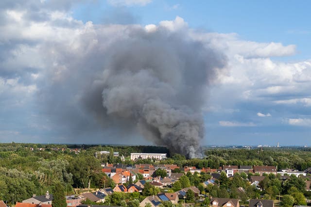 <p>Smoke caused by a fire billows above the site of the Tomorrowland electronic music festival in Boom, northern Belgium </p>