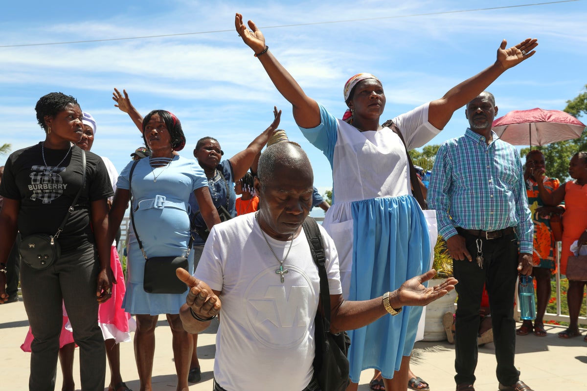 Thousands of Haitians mark annual pilgrimage far from a sacred waterfall surrounded by gangs