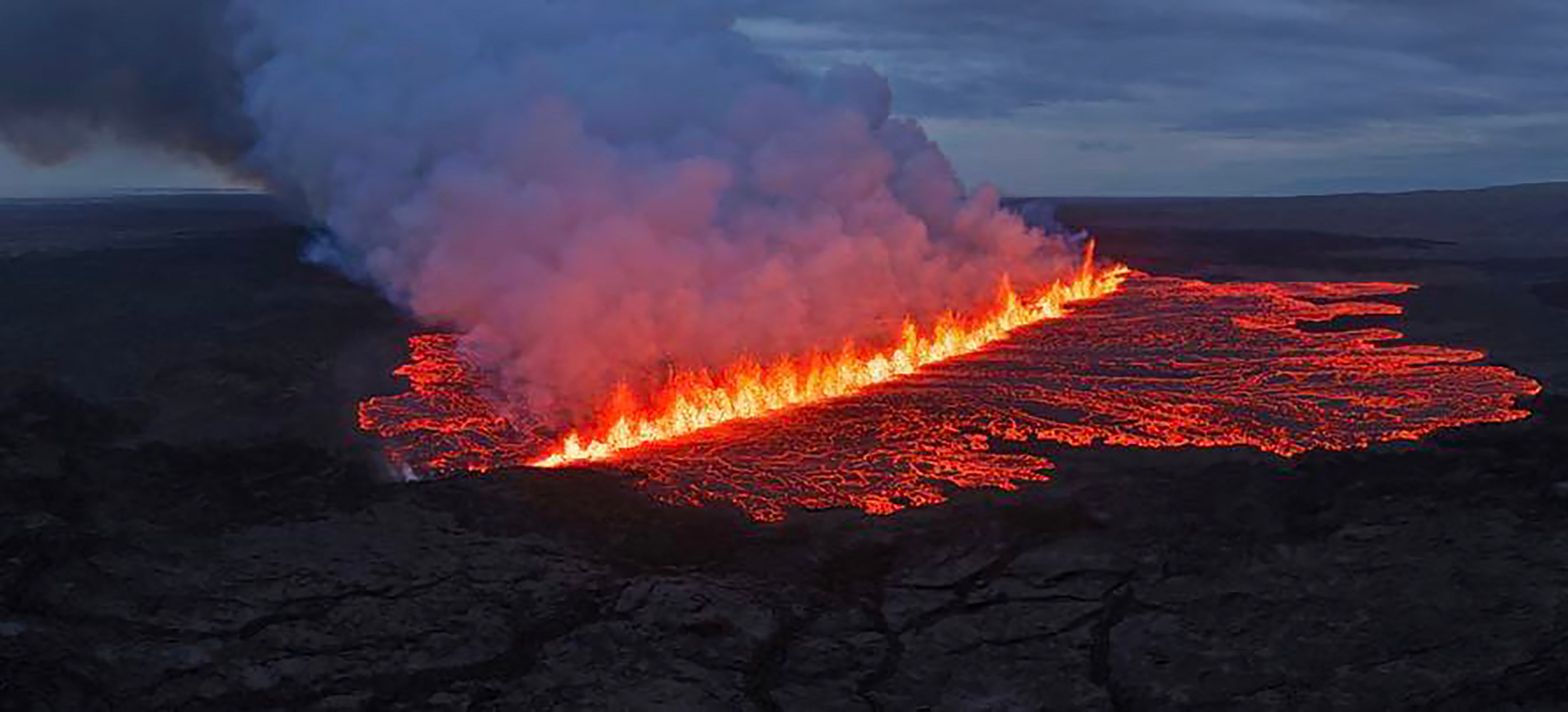 Lava and smoke erupting from a volcano near Grindavik on the Icelandic peninsula of Reykjanes