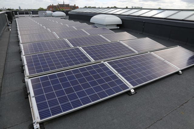 Solar panels on the roof of a new school in Hornechurch, east London (PA)