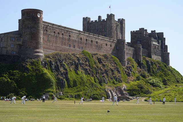 Bamburgh Castle features on the interactive map of coastal landmarks by Historic England (Owen Humphreys/PA)