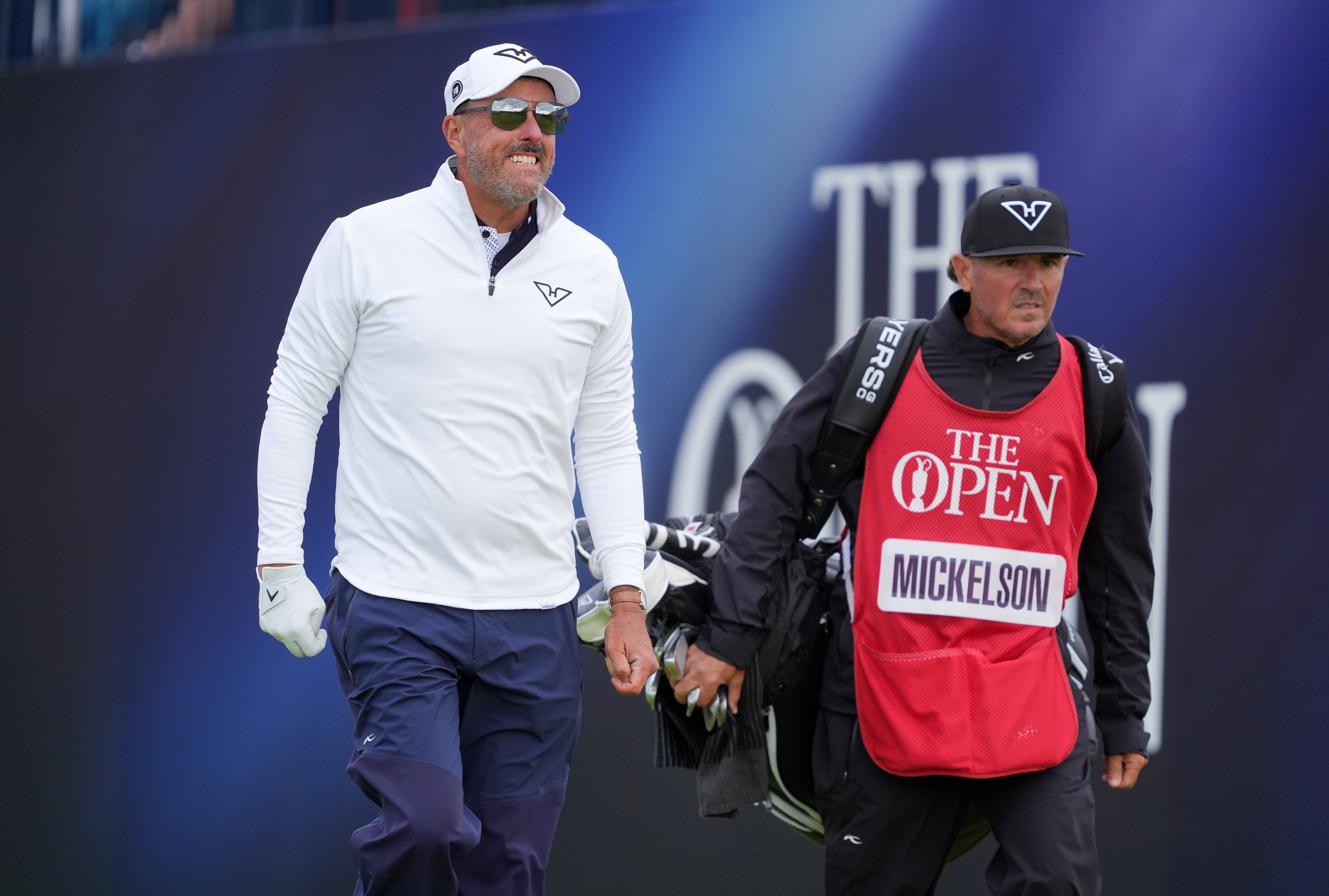 USA's Phil Mickelson and caddie Jon Yarbrough on day one
