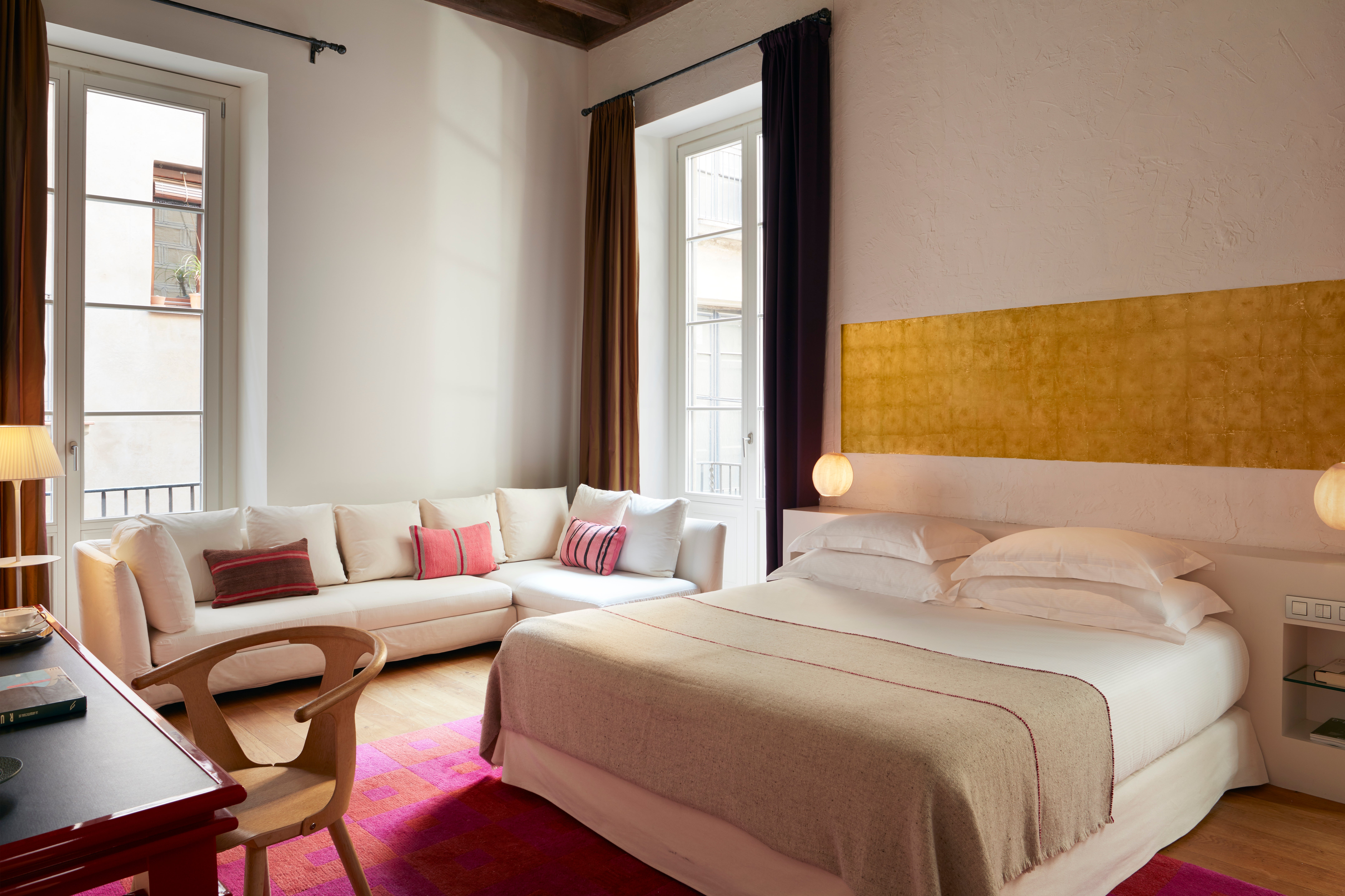 Splashes of hot pink and gold brighten up a stay at Hotel Neri