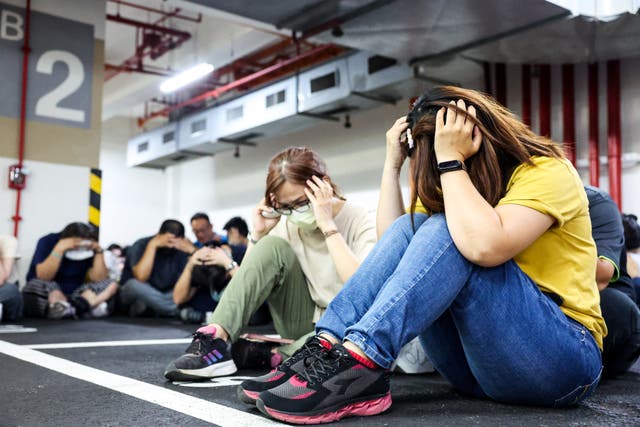 <p>People take shelter during an air raid drill coinciding with the Han Kuang military exercises in Taipei</p>