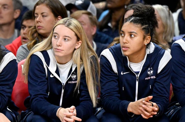 <p>Fudd (right) has a phone case that says ‘Paige Bueckers’ girlfriend’</p>