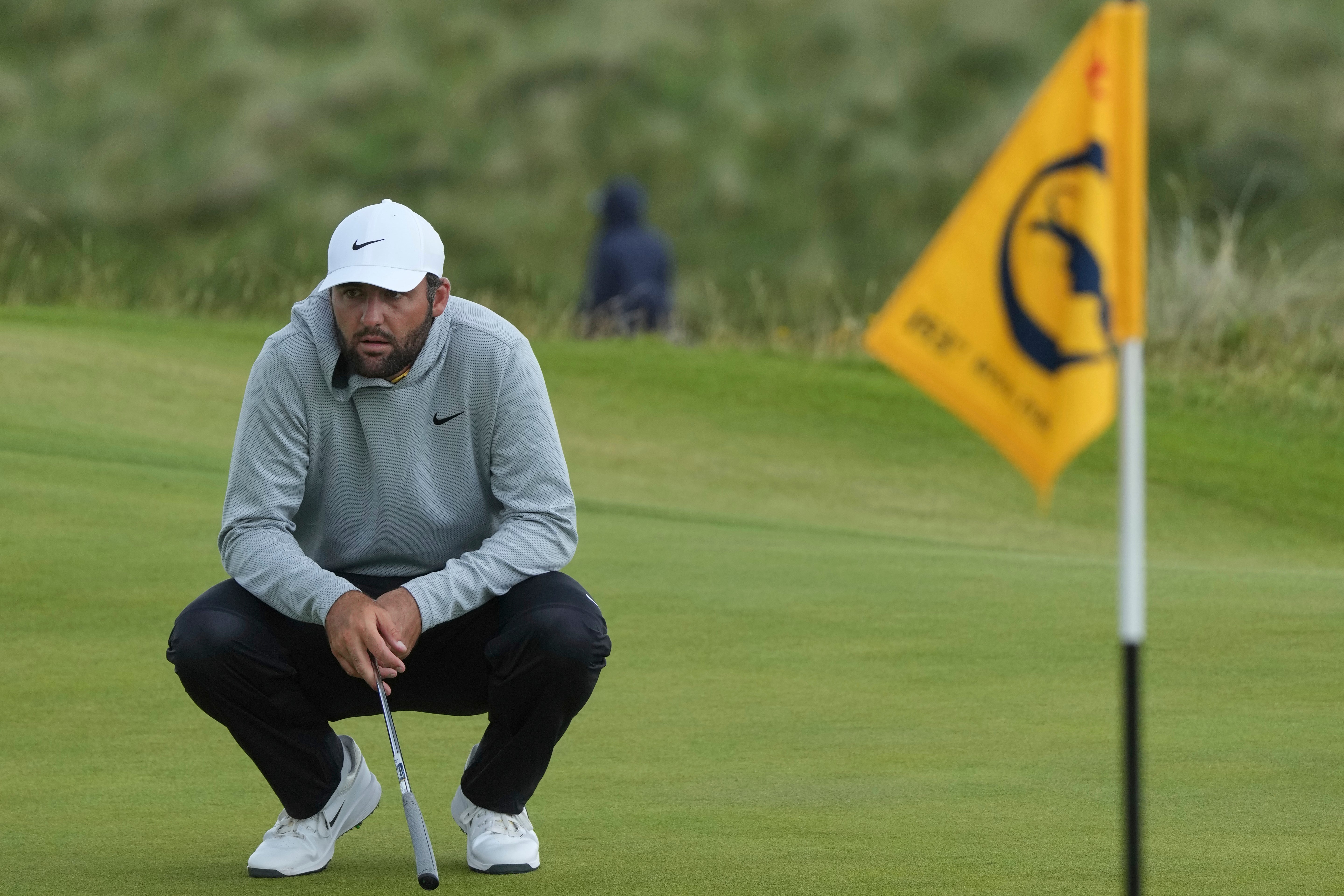 Scottie Scheffler of the United States waits to putt on the 8th green