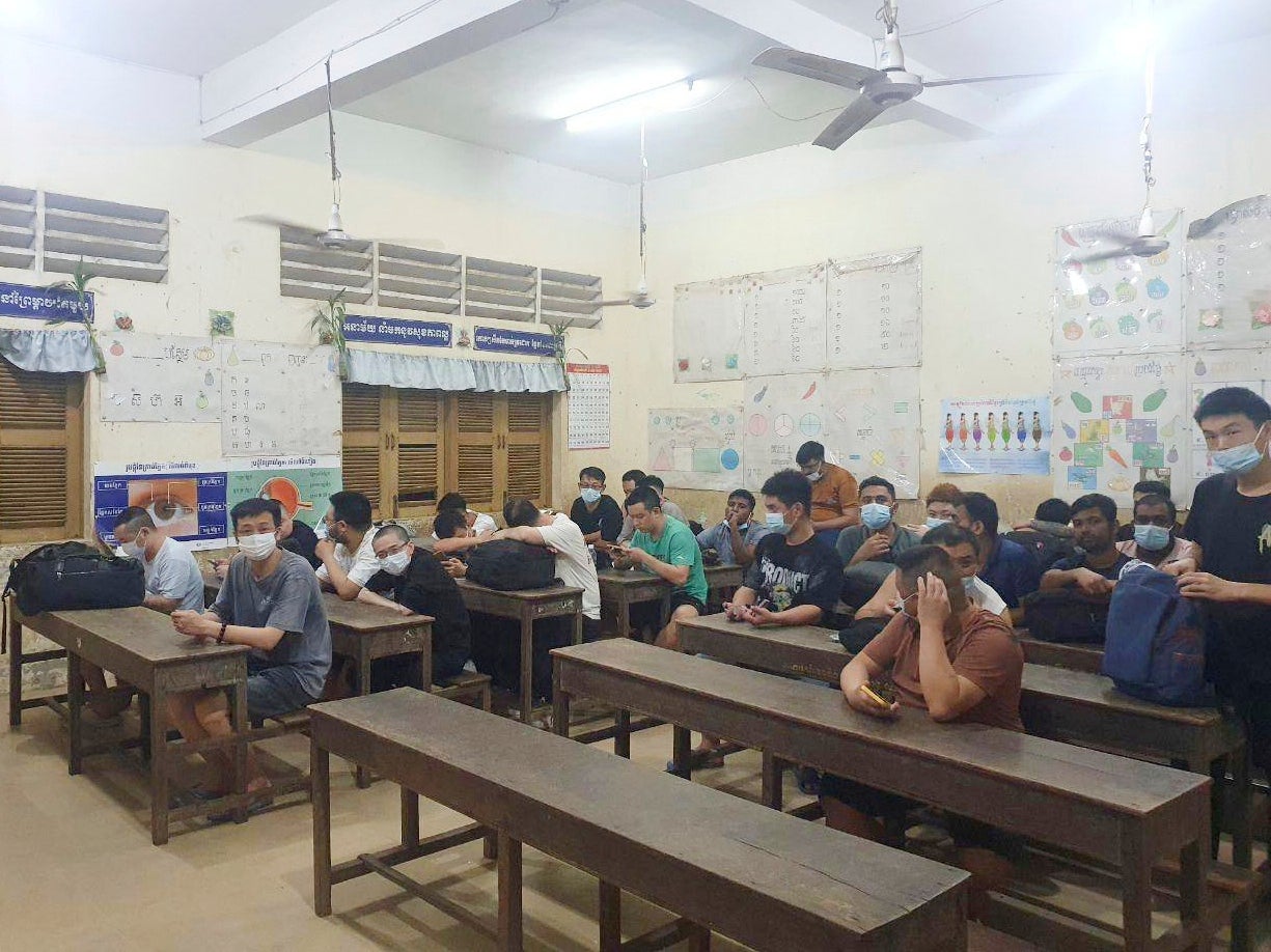 Alleged nline scammers arrested by authorities sit in a classroom on the outskirts of Phnom Penh, Cambodia, Friday, July 18, 2025