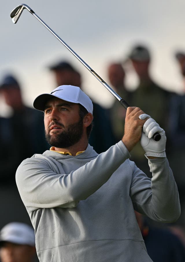 <p>Scottie Scheffler watches his iron shot on the 16th tee on day two </p>