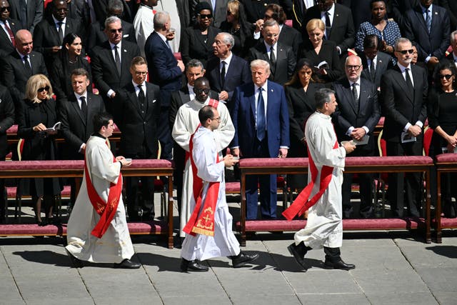 <p>President Donald Trump stands with foreign leaders and monarchs as he attends the funeral of Pope Francis in the Vatican City on April 26, 2025</p>