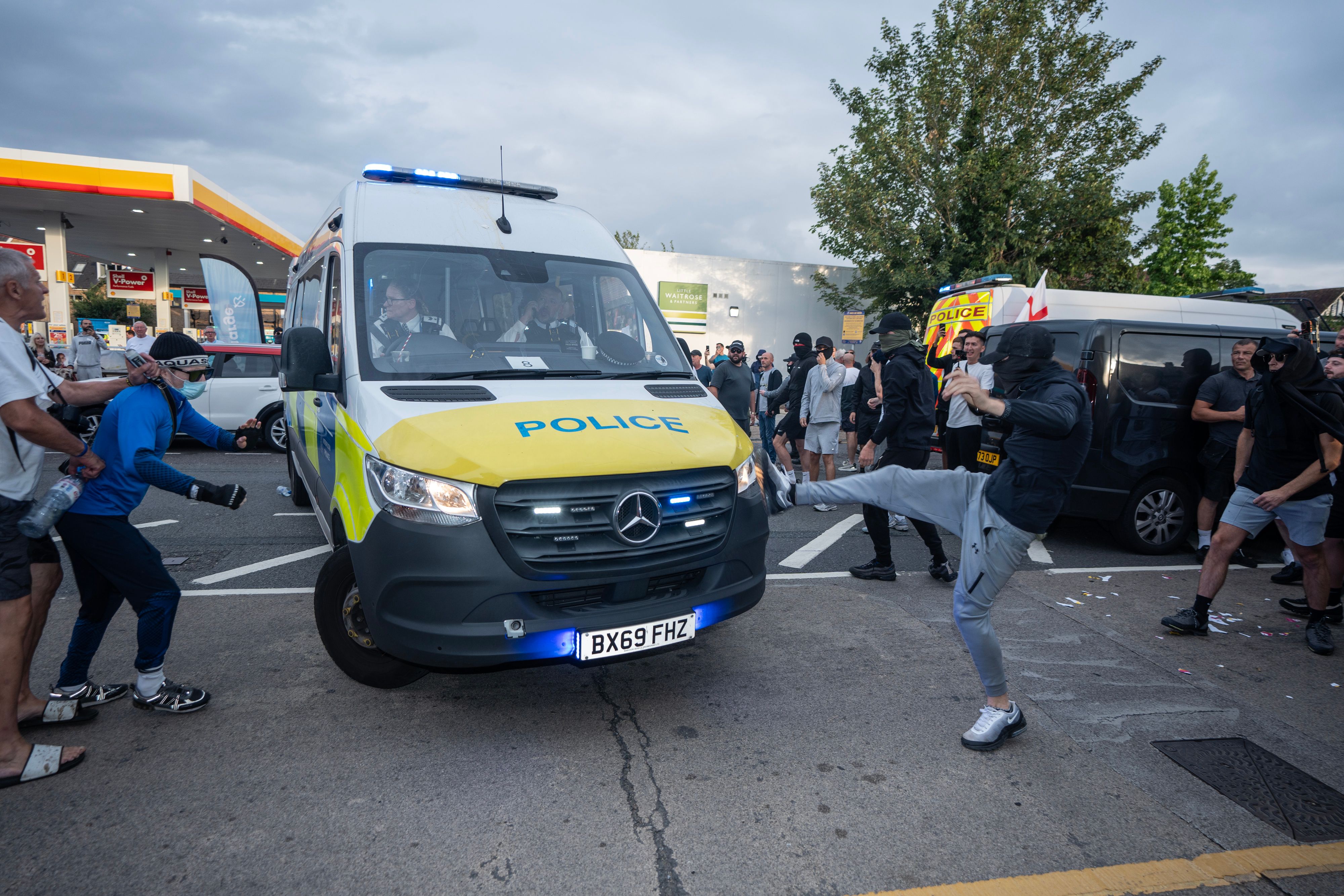 Police and protesters clash outside the Bell Hotel in Essex