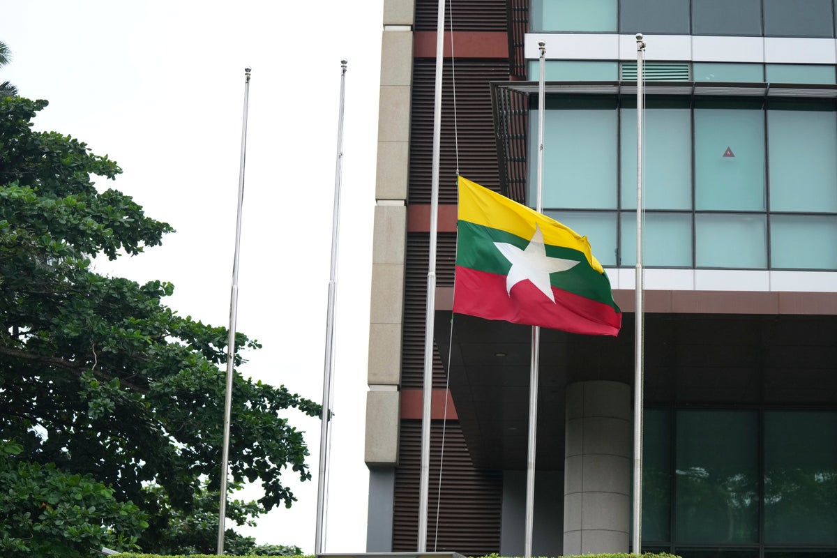 Myanmar's military leader puts in rare appearance at event honoring Aung San Suu Kyi's father