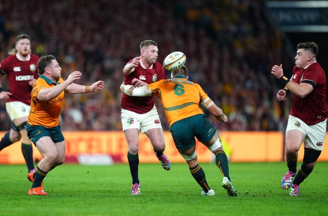 <p>Finn Russell (centre) cast a spell over the home defence (David Davies/PA)</p>