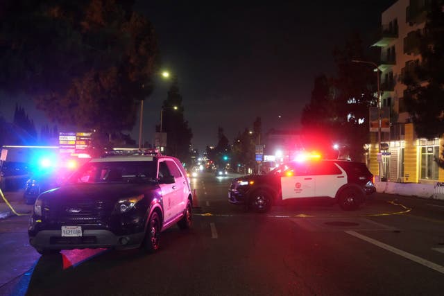 <p>Police patrol vehicles close Vermiont Ave. after a vehicle rammed into a crowd gathered outside "The Vermont" nightclub in Los Angeles</p>