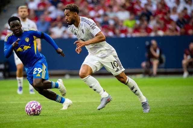 <p>Matheus Cunha of Manchester United is challenged for the ball by Wilfried Gnonto of Leeds United </p>