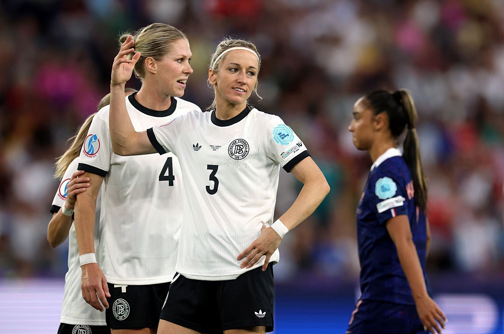 Kathrin Hendrich of Germany reacts after being shown a red card for pulling an opponent’s hair