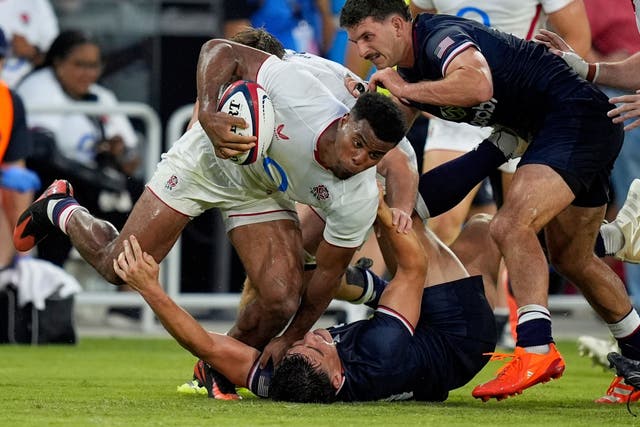 England’s Immanuel Feyi-Waboso takes on the US defence (Alex Brandon/AP)