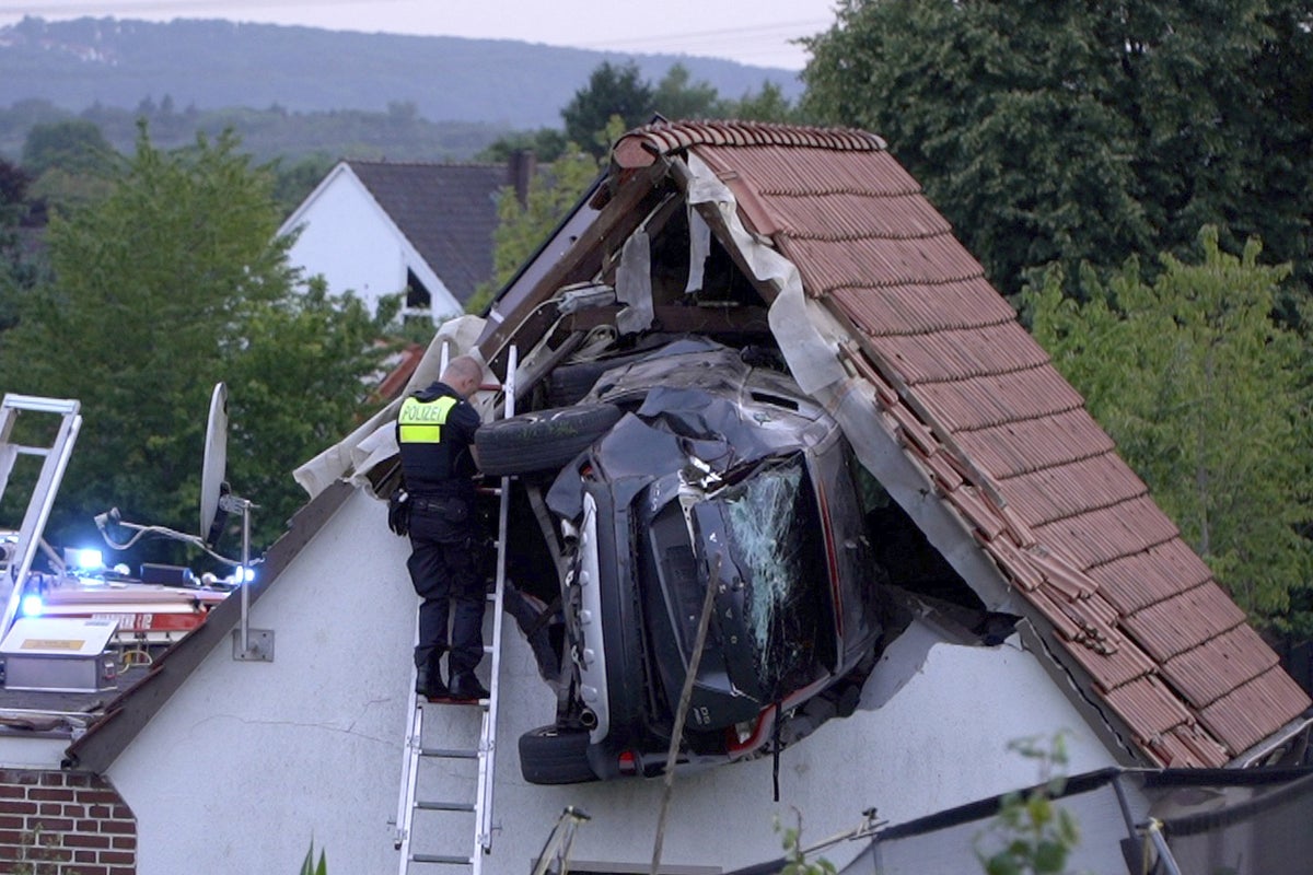 Car becomes stuck in roof after striking boy, 7, in crash