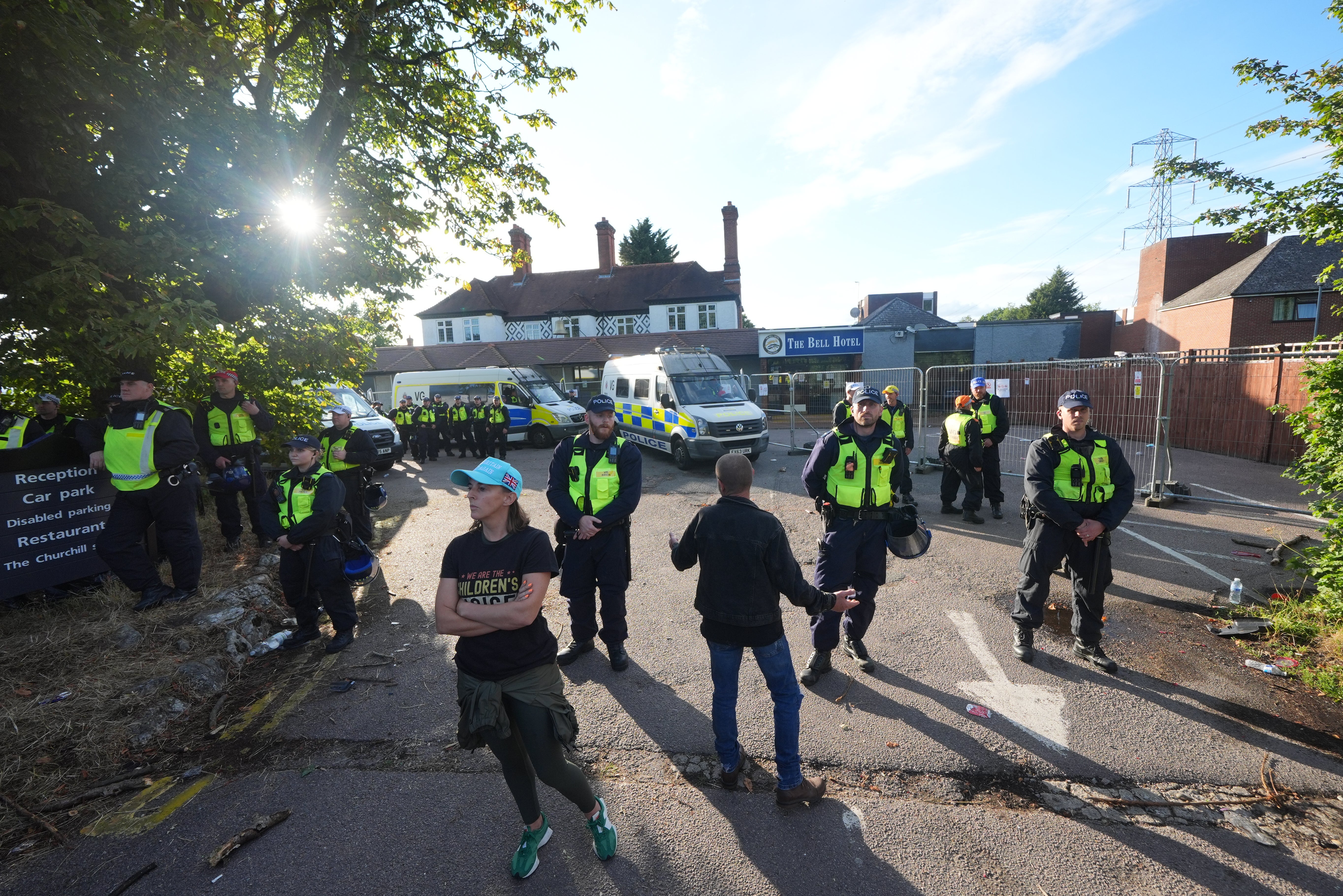 Bottles and smoke flares were later thrown towards police vans blocking the entrance to the hotel