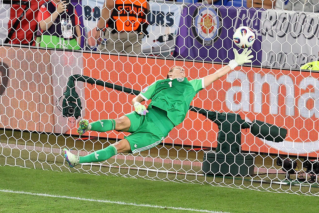 Berger scrambles back to claw the header off the line