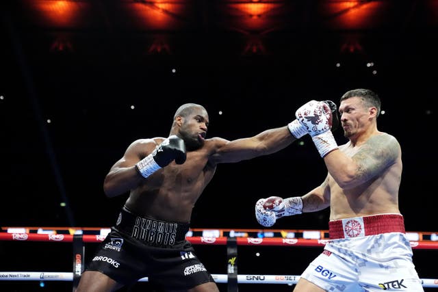 <p>Oleksandr Usyk and Daniel Dubois, left, in action at Wembley (Bradley Collyer/PA)</p>