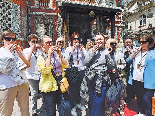 <p>Tourists at the Porcelain House, a French-style mansion featuring more than 700 million porcelain shards and more than 13,000 antique porcelain vases, plates and bowls, in Tianjin, on 6 May</p>