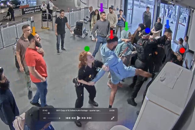 CCTV still of Pc Lydia Ward (green dot) and Mohammed Fahir Amaaz (red arrow), Pc Ellie Cook (blue dot), Pc Zachary Marsden (red dot) and Muhammad Amaad (blue arrow), during the alleged assault (Aamer Anwar/PA)