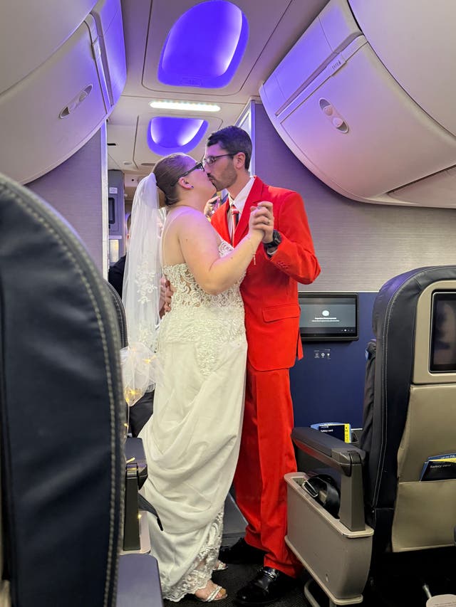 <p>The happy couple share a kiss</p>