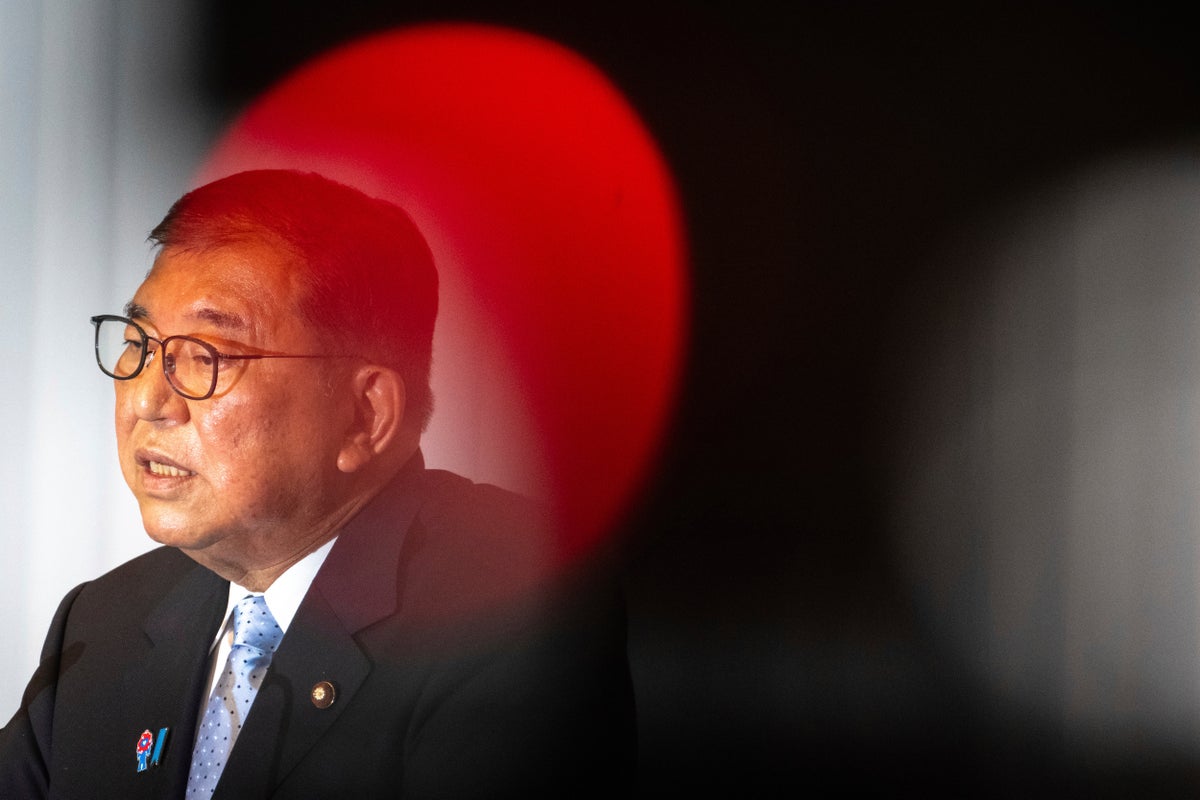 Japan PM Shigeru Ishiba clings to power after bruising defeat in parliament