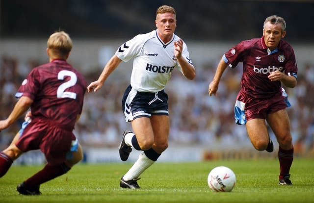 <p>Paul Gascoigne races past Peter Reid during a Division One match between Tottenham Hotspur and Manchester City at White Hart Lane in 1990</p>