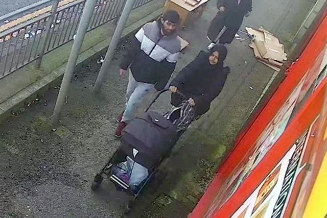 Habibur Masum walking with his wife Kulsuma Akter and their baby (West Yorkshire Police/PA)