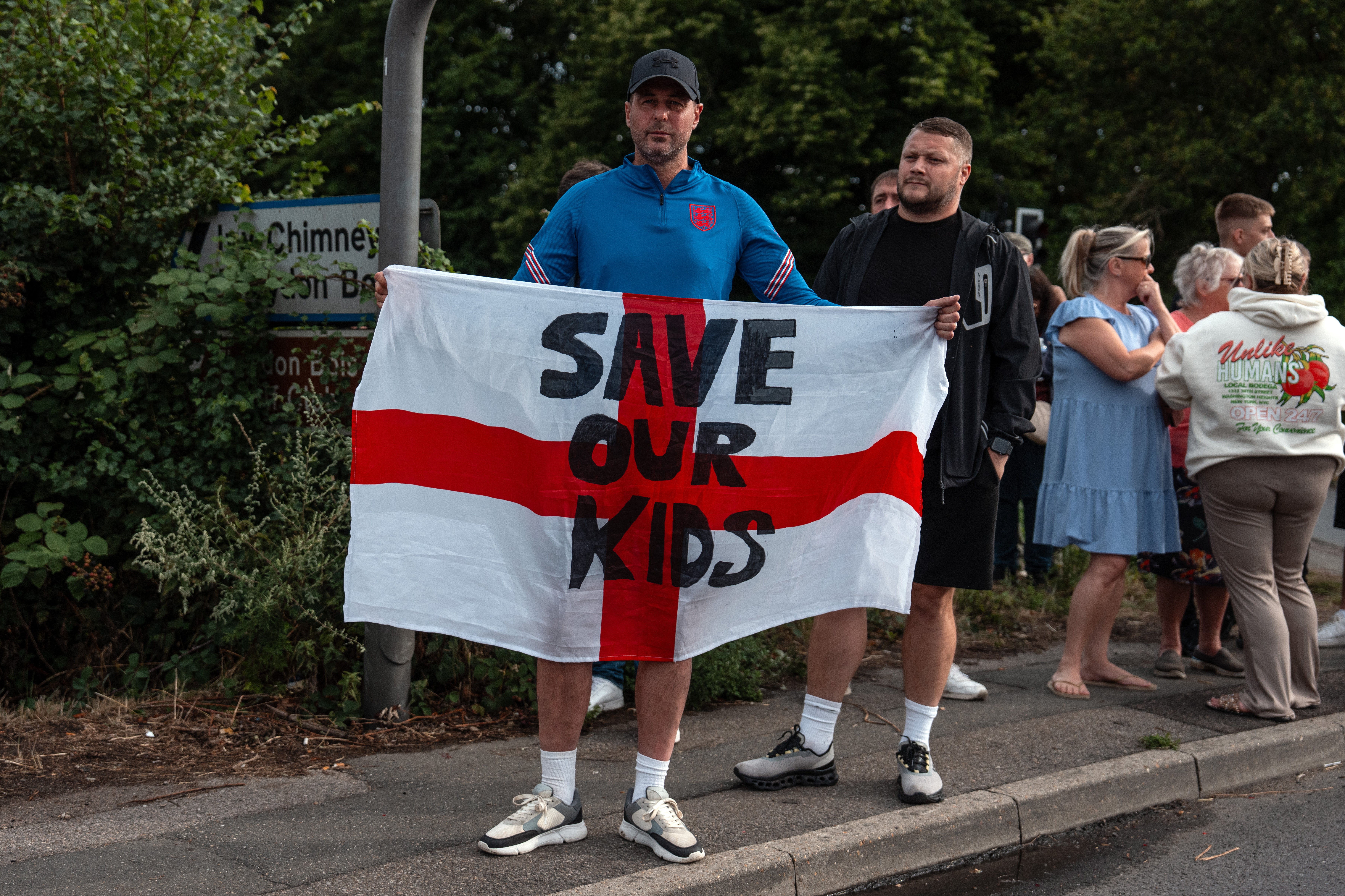 Some peaceful protesters held flags reading 'Save our kids'