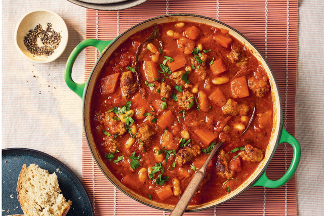 <p>Hearty, smoky and packed with veg, this sausage and bean casserole is the ultimate winter warmer – and it freezes beautifully too</p>