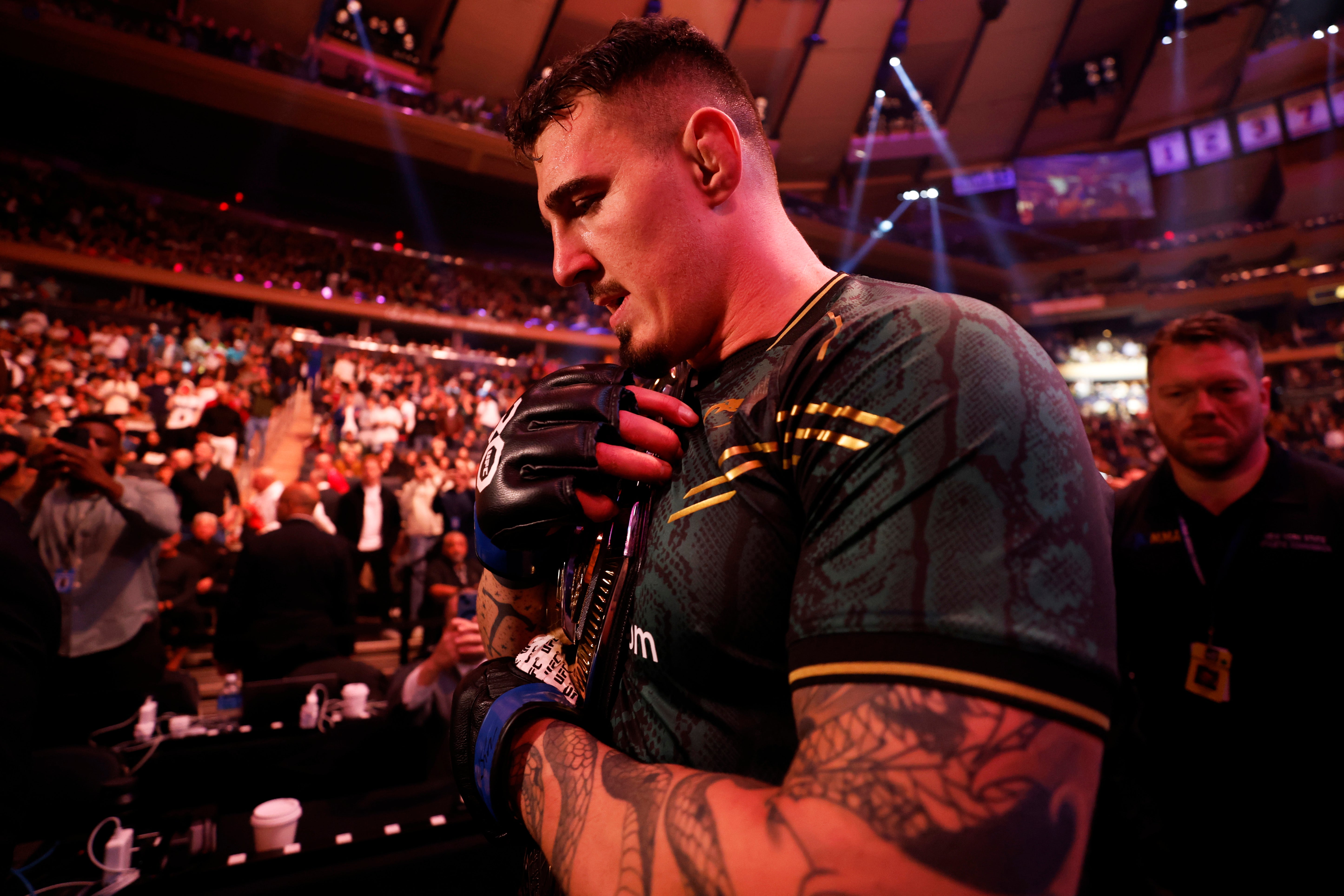 <p>Tom Aspinall celebrates winning the interim UFC heavyweight title in 2023</p>