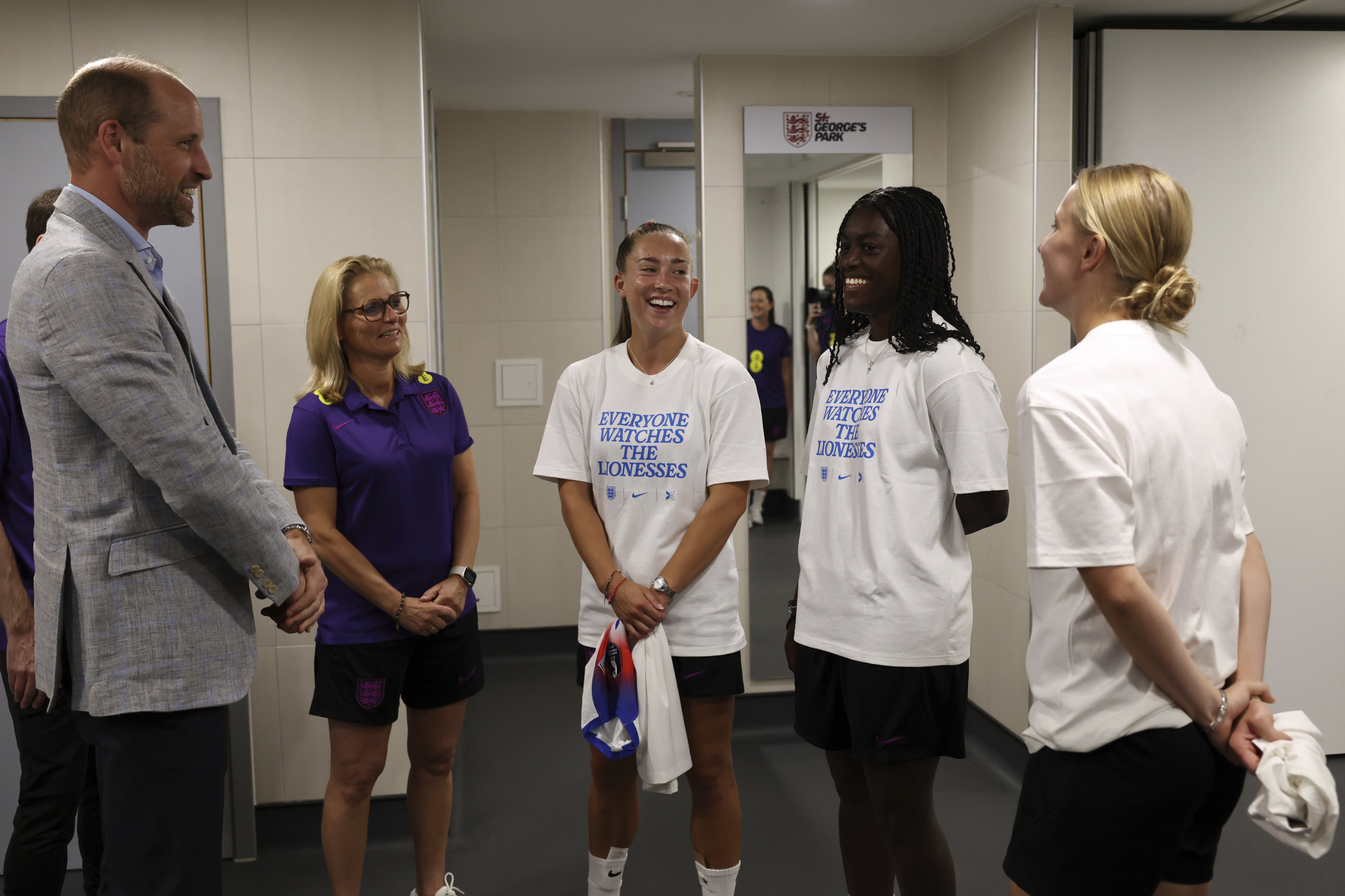 <p>The Prince of Wales speaks to (left to right) head coach Sarina Wiegman, Maya Le Tissier, Michelle Agyemang and Aggie Beever-Jones as he meets players and coaching staff from the England Women’s team during a visit to St George’s Park </p>