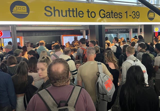 <p>First wave: the 5.45am queue for the Shuttle at Stansted airport in Essex on 21 July 2025</p>