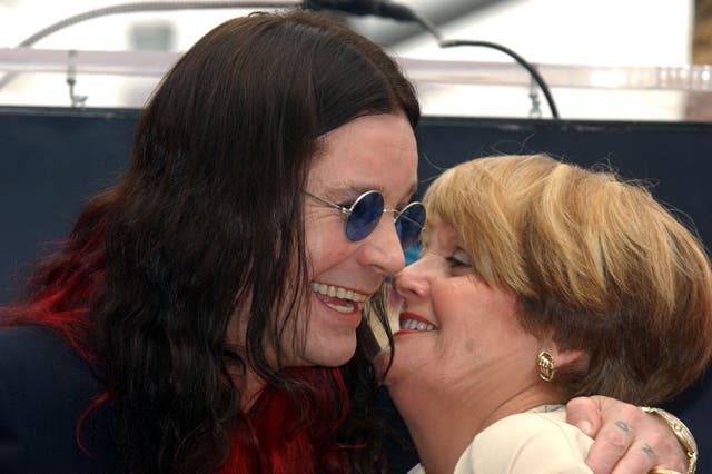 <p>Ozzy Osbourne embracing his sister Jean Powell during his Hollywood Walk of Fame ceremony in April 2002</p>