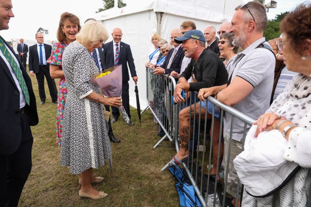 Camilla met members of the public, including tattooed royal superfan Phil Smith, during a visit to the Sandringham Flower Show in Norfolk (Chris Radburn/PA)