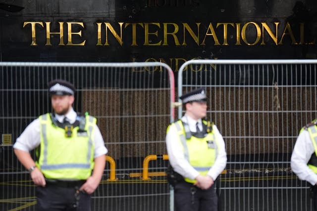 <p>A 22-year-old woman has been charged with assaulting a security guard at a hotel housing migrants after one of its residents allegedly walked into her flat</p>